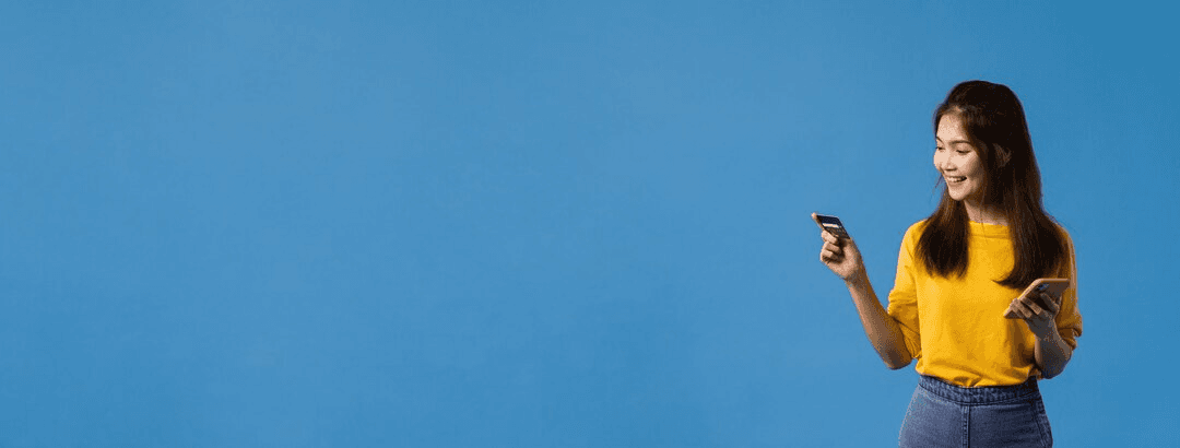 Woman with phone on blue background